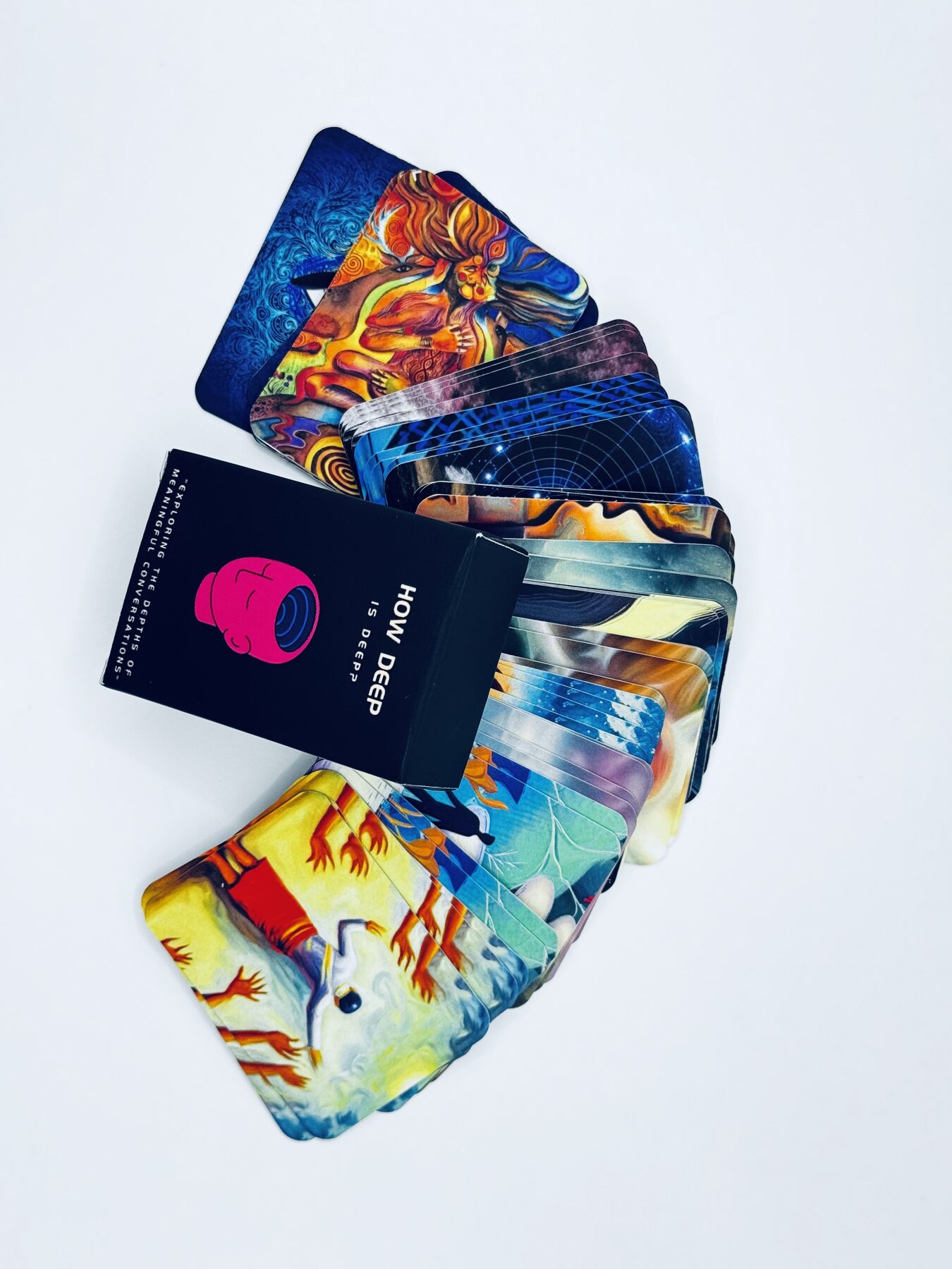 A fan of cards showing varied surrealist artwork